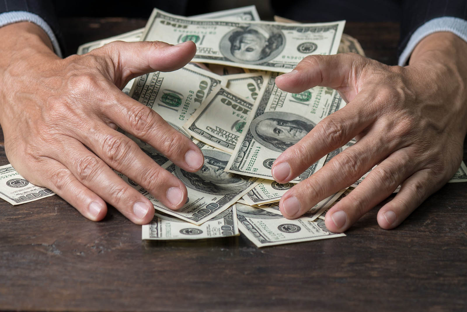 Most People Can’t Spell Half of These Words Correctly — How Well Can You Do? Hands Holding Money