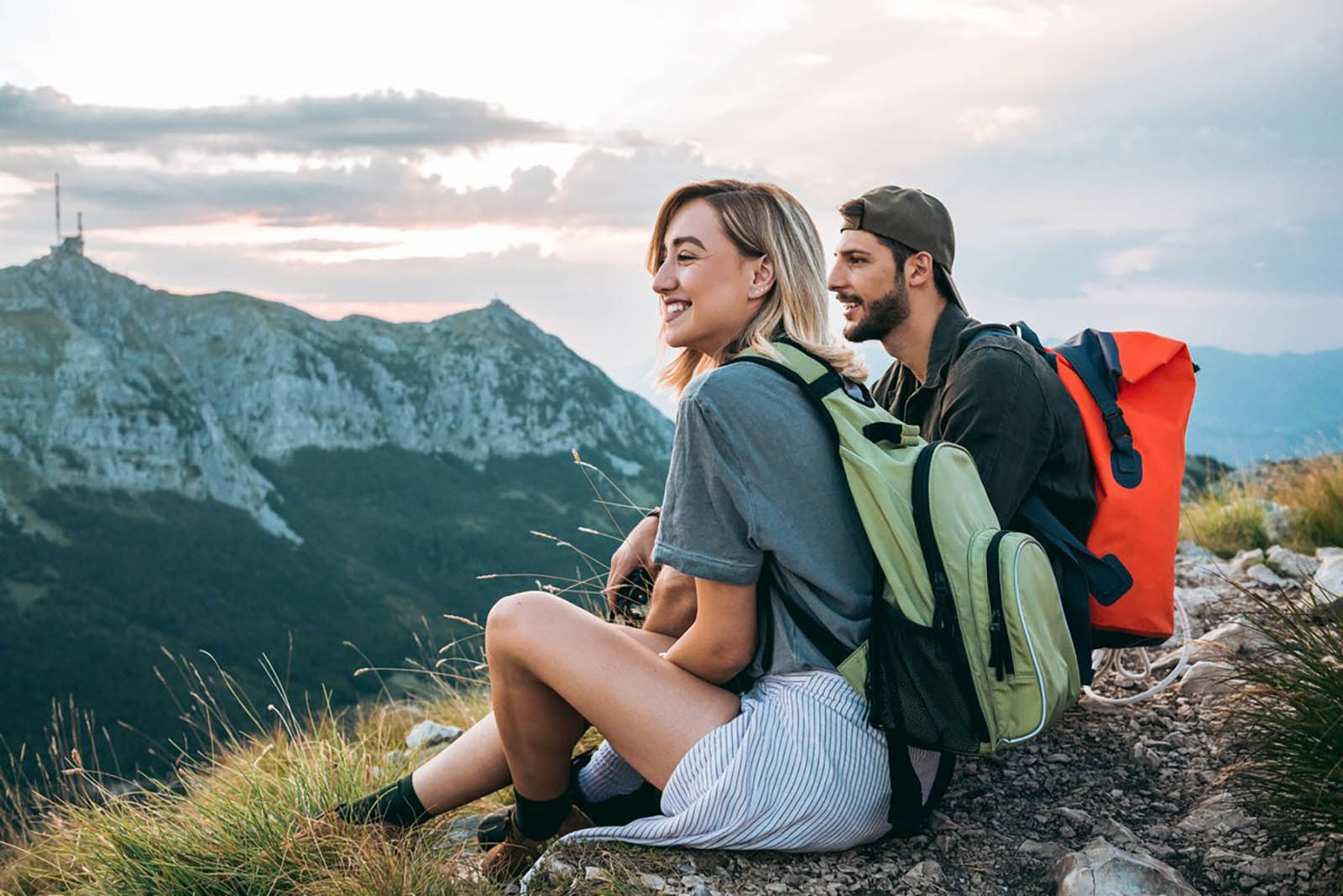 ✈️ Travel Somewhere for Each Letter of the Alphabet and We’ll Tell You Your Fortune Man And Woman Hikers On Mountaintop Nature Outdoor Travel