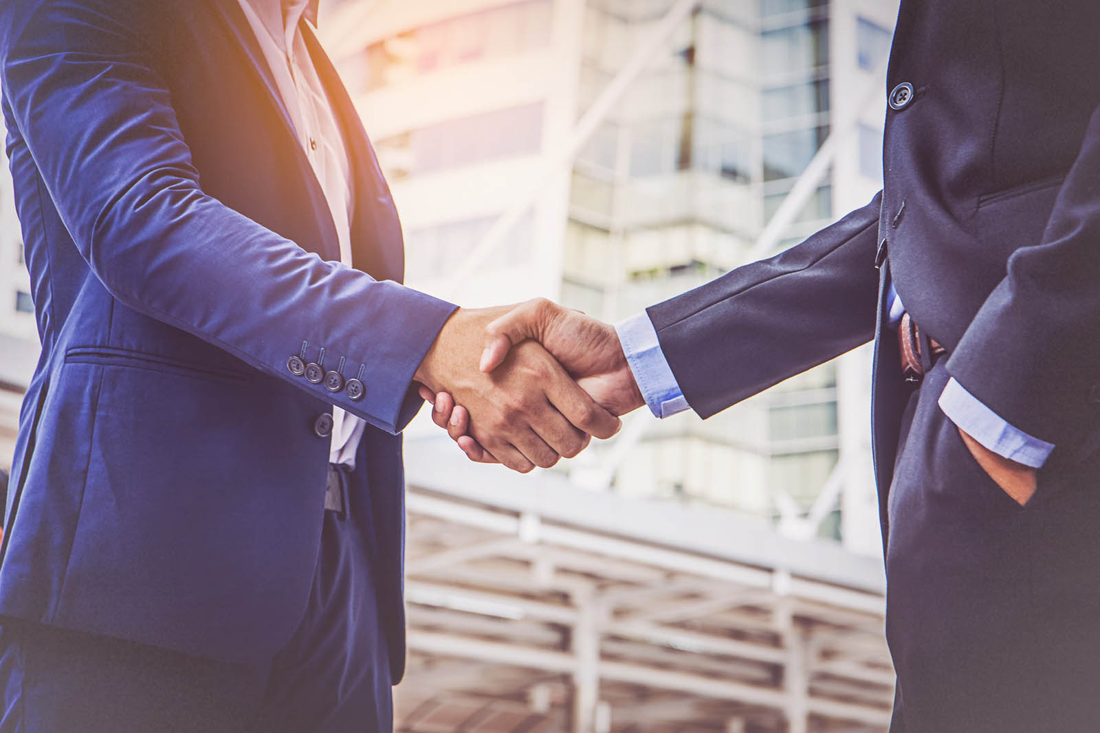 Only Someone With Perfect Grammar Can Score 15/15 on This Quiz Two Businessmen Shaking Hands