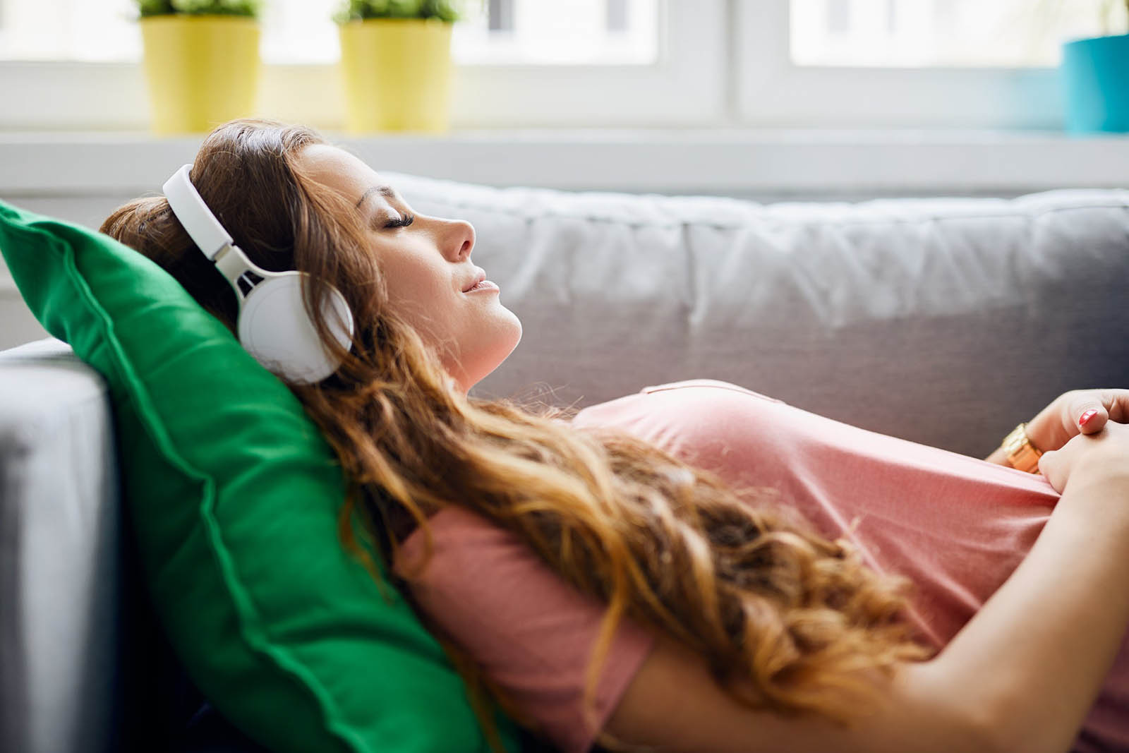 Art Of Adulting Test 🚶‍♂️: Yes Or No, Are You Nailing It? Young Woman Relaxing On The Couch Listening To Music Via Headphones