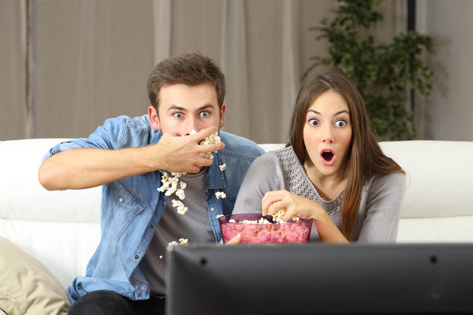 🍿 Can We Guess Your Age Based on Your Netflix Habits? Quiz Excited Couple Watching Tv