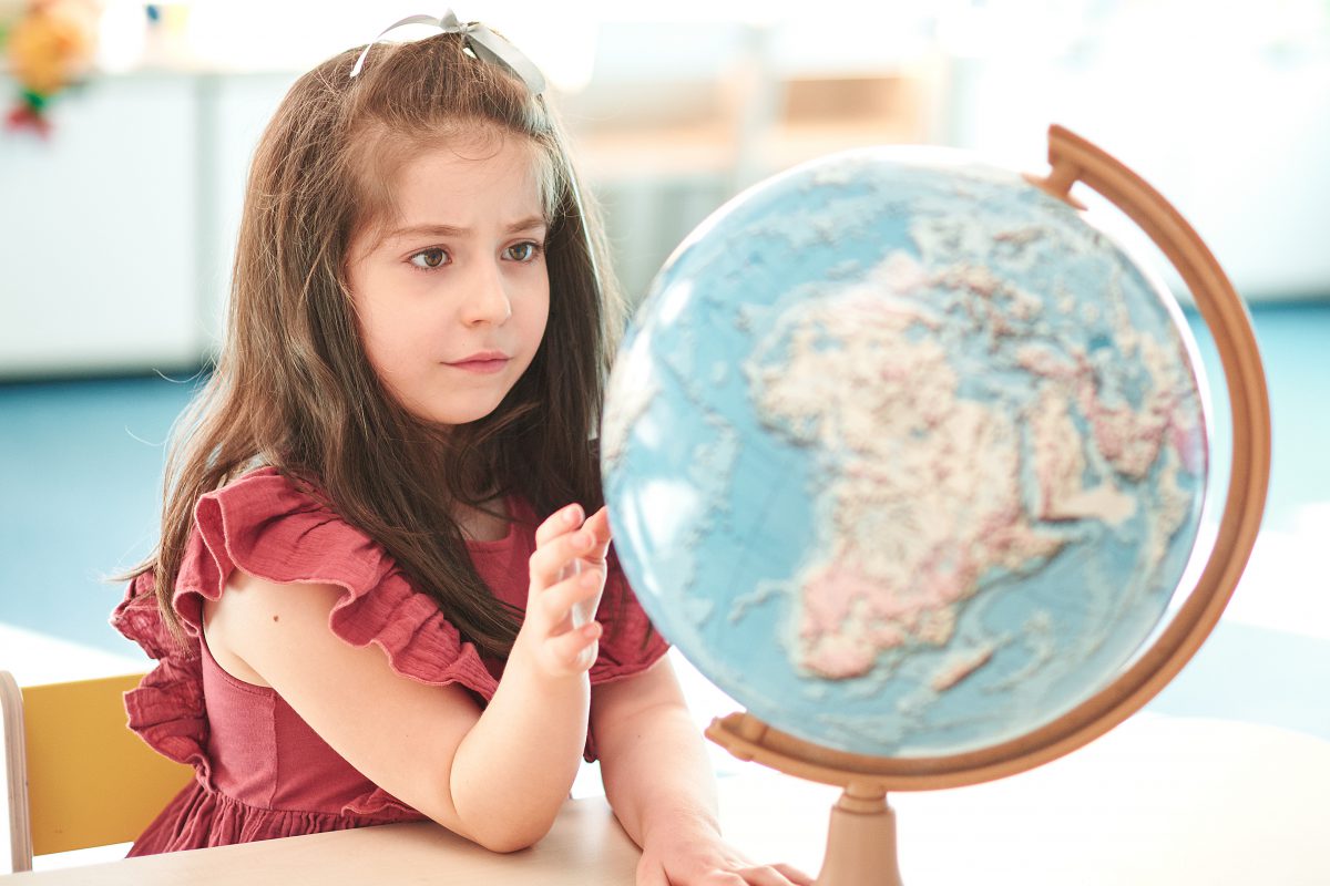Can You Make It Through the Geography Version of “Two Truths and a Lie”? Girl Child Kid Study Globe World Map Geography