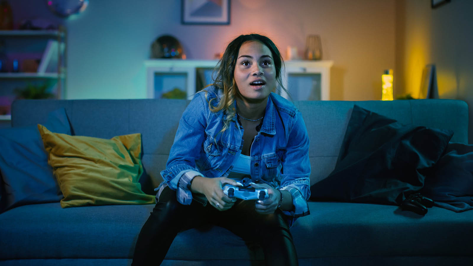Percy Jackson Cabin Quiz Woman On A Couch Playing A Video Game
