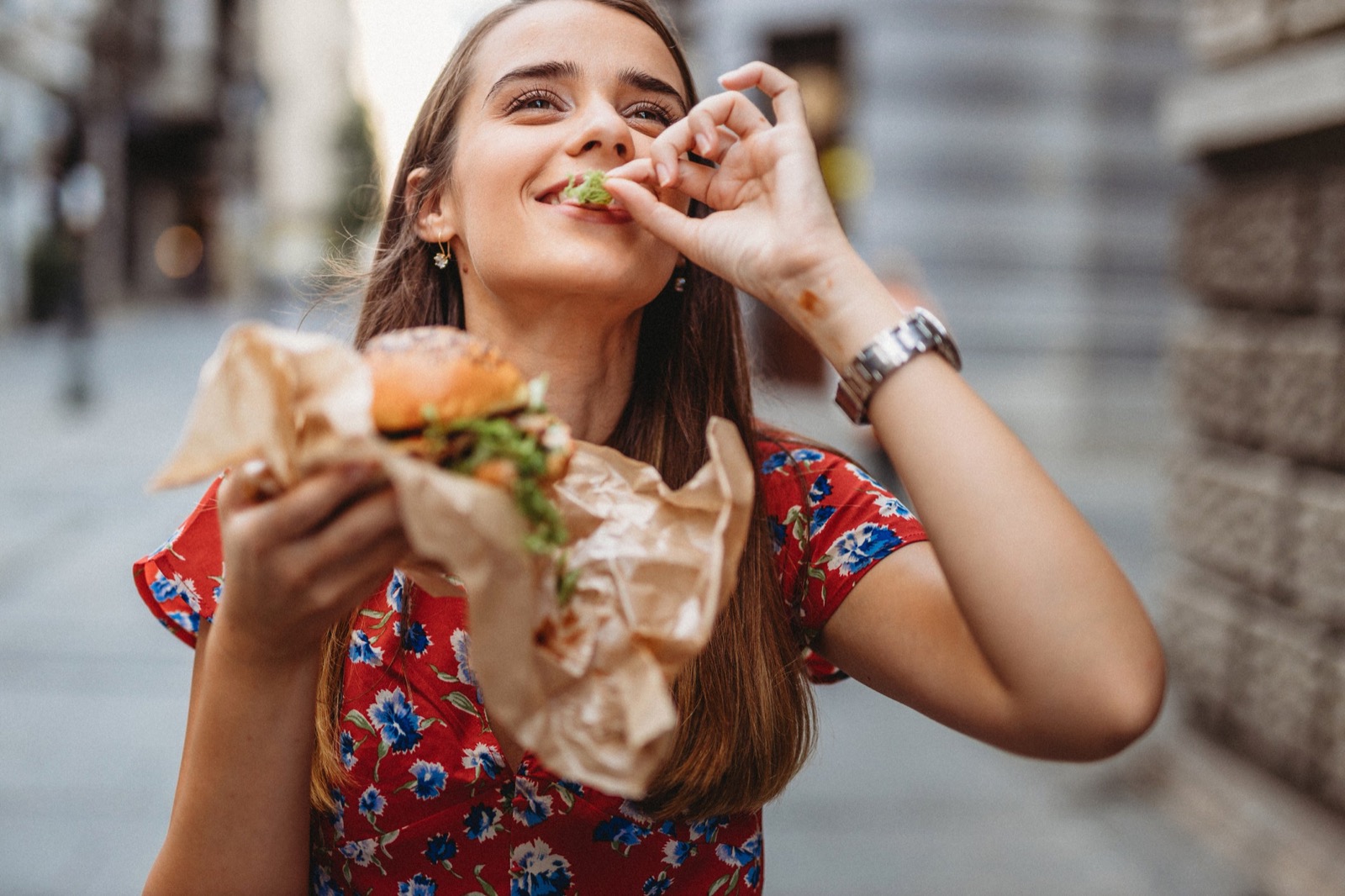 Are You American, Australian, British, Or Canadian When It Comes to Eating? Woman Eating Burger