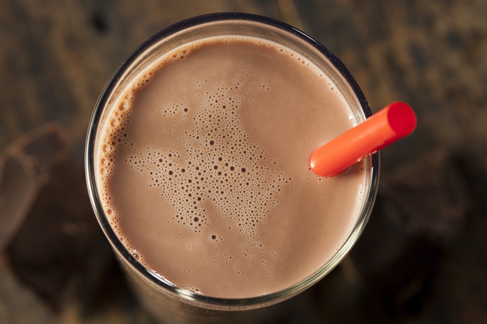 This Food Showdown Quiz Is Scientifically Designed to Determine What Kind of Optimist or Pessimist You Are Chocolate Milk On A Glass With Red Straw