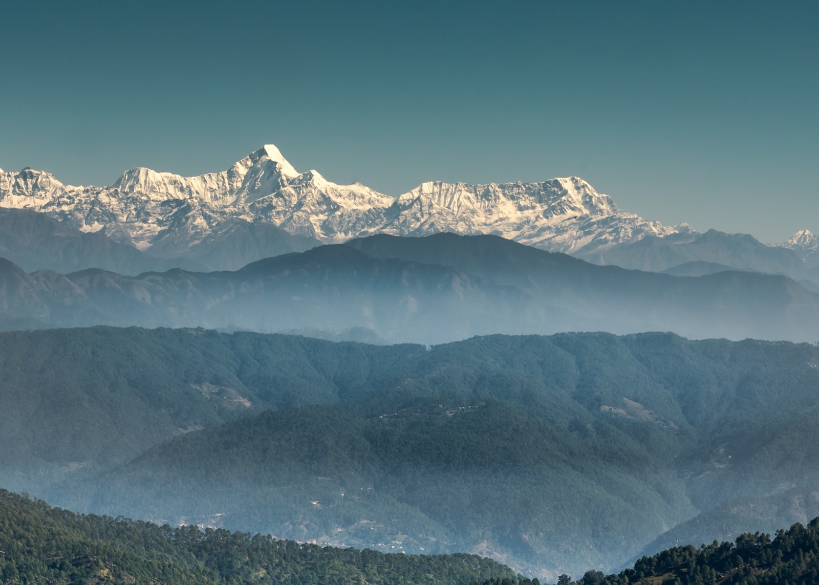 Landscape view of the Himalayan mountain ranges on a clear sky background