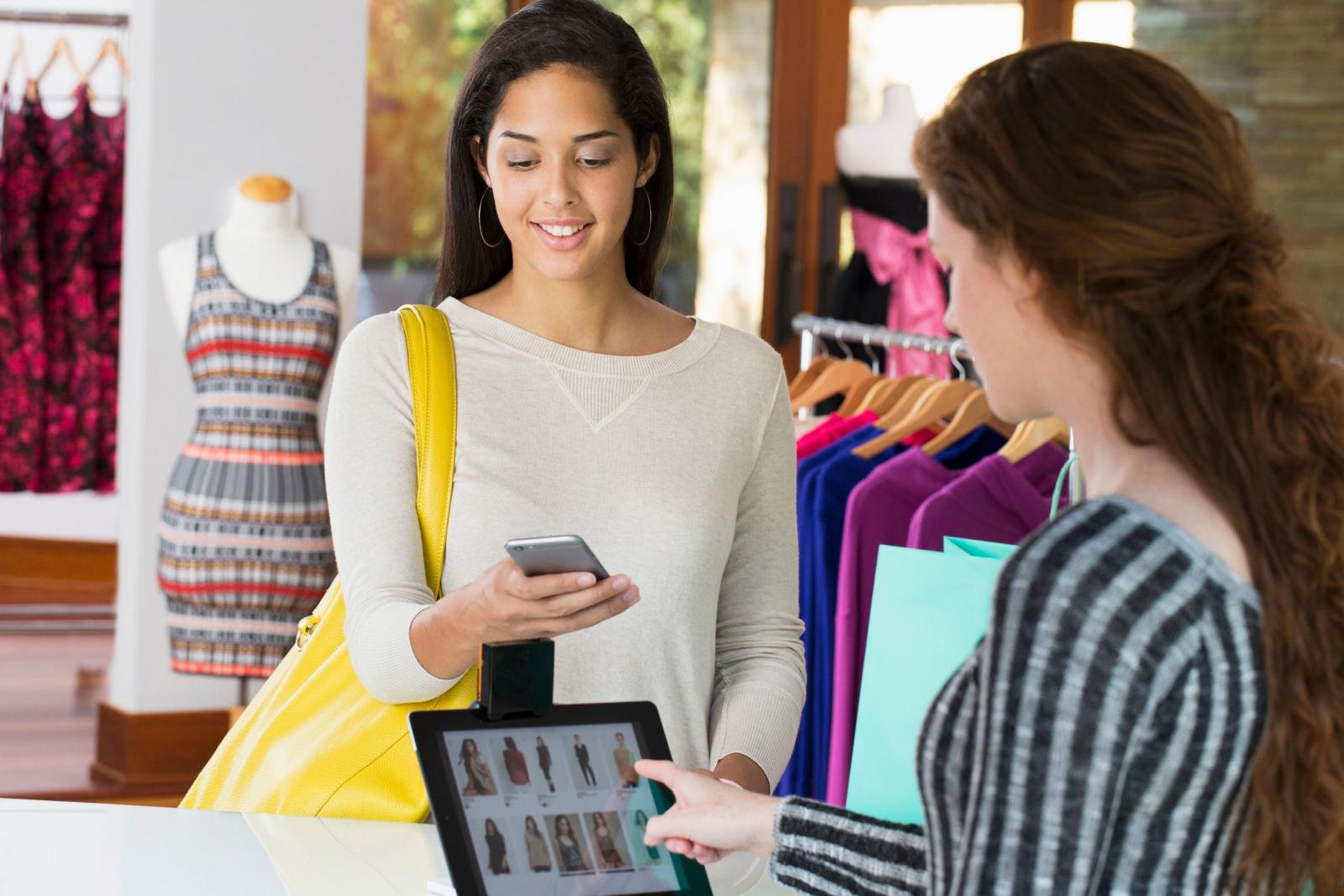 Fashion Clothes Shopping Woman Paying At A Cashier With A Mobile Wallet