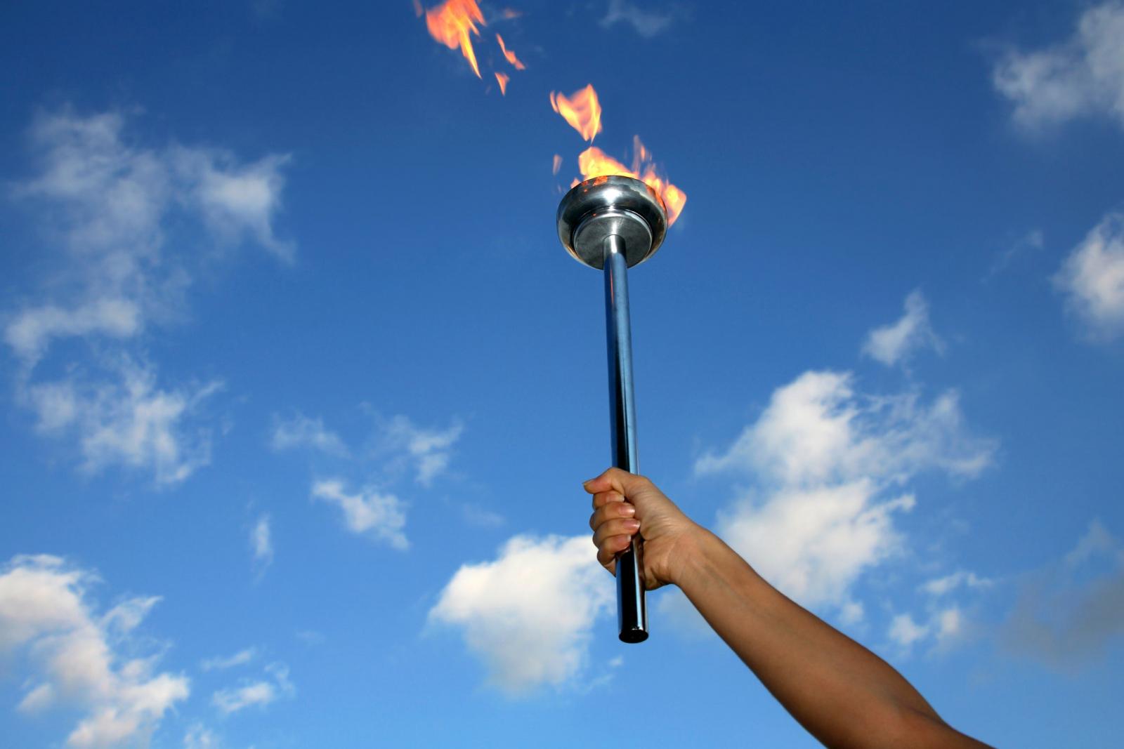 If We Give You a Hint, Can You Name the Most Populated Cities in the World? Person Holding Lit Torch In Sky Olympics