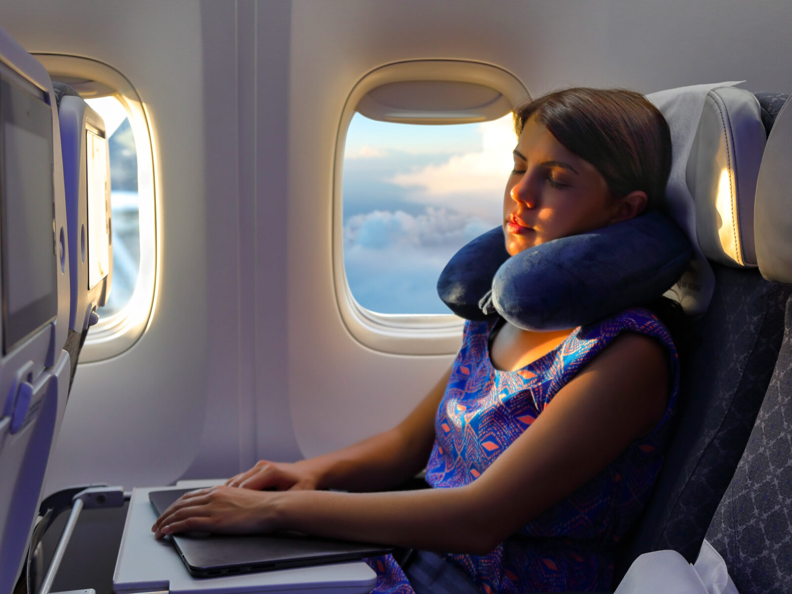 ✈️ Your Airplane Habits Will Reveal Whether You Are a Seasoned Traveler neck pillow flight woman sleep