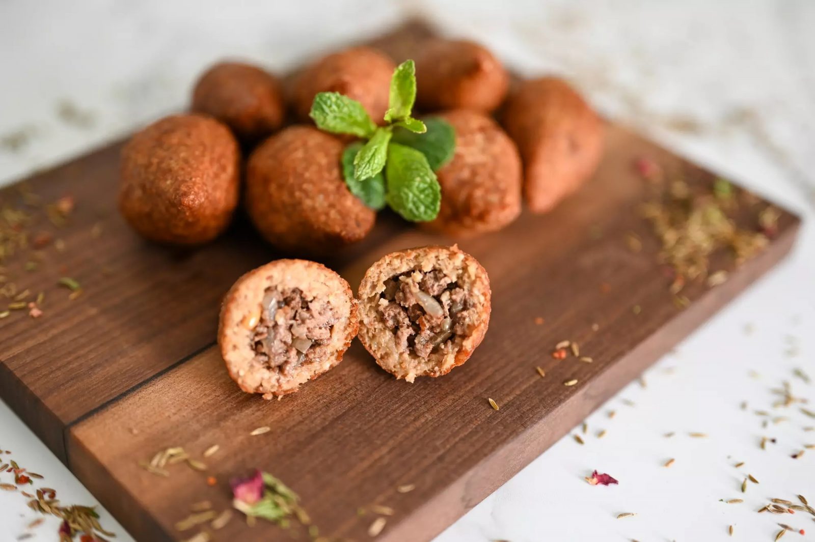 🥟 Unleash Your Inner Foodie with This Delicious Asian Cuisine Personality Quiz 🍣 Kibbeh (beef or lamb balls)