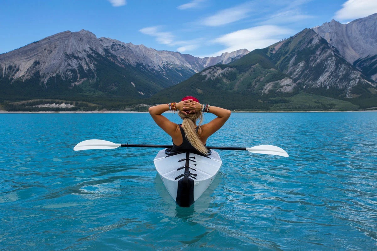 Plan a Trip to Canada and We’ll Reveal Which Dog Breed Suits You the Best kayaking