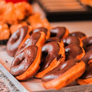 Eat Bougie Brunch To Know What Holiday Matches Your Vibe Quiz Chocolate Boston cream orange doughnut