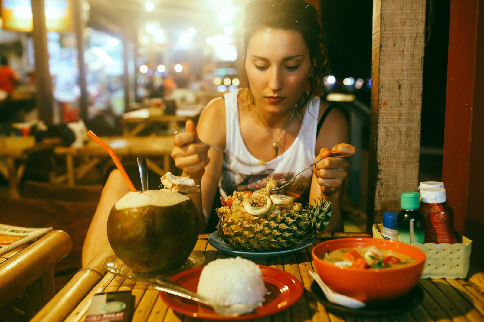 How Would You Fare Without ⚡️ Electricity? Choose Between These 🥗 Retro Dishes to Find Out Woman eating Thai cuisine pineapple rice