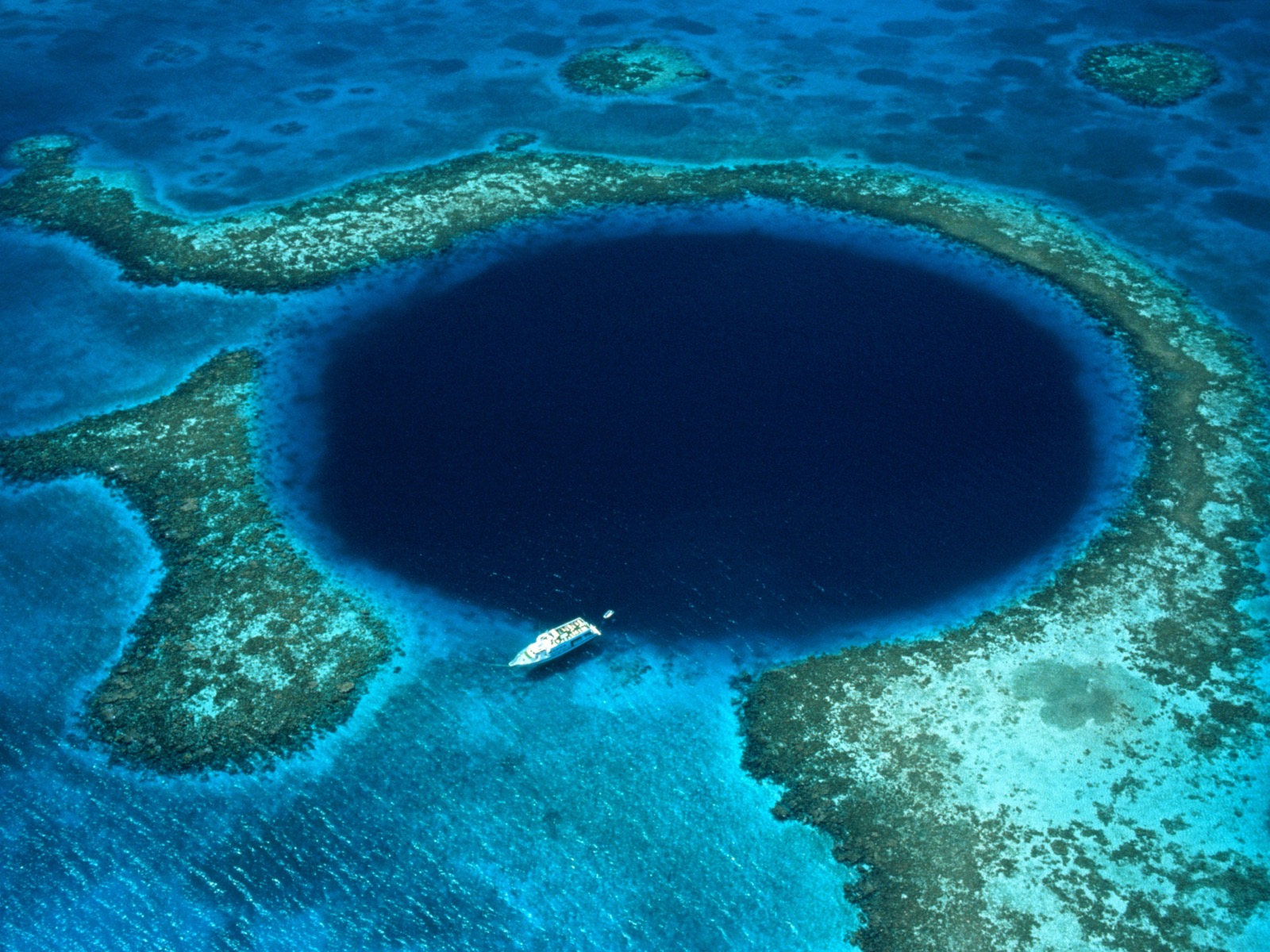 This Travel Quiz Is Scientifically Designed to Determine the Time Period You Belong in Dive Belize\'s Great Blue Hole