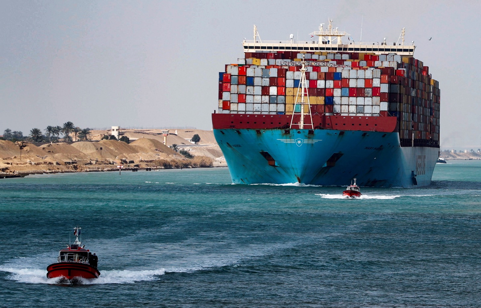 🚢 Journey Around the World in 24 Questions – How Well Can You Score? A shipping container passes through the Suez Canal in Suez