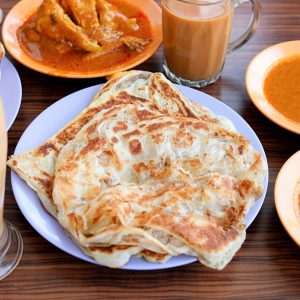 🥟 Unleash Your Inner Foodie with This Delicious Asian Cuisine Personality Quiz 🍣 Roti prata (Indian flatbread)