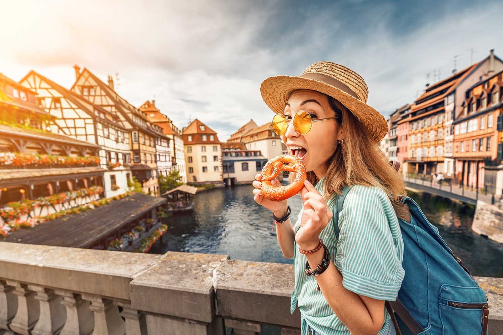 Choose Between Sweet and Salty Snacks and We’ll Guess Your Current Relationship Status Tourist eating delicious pretzel while travelling in Europe