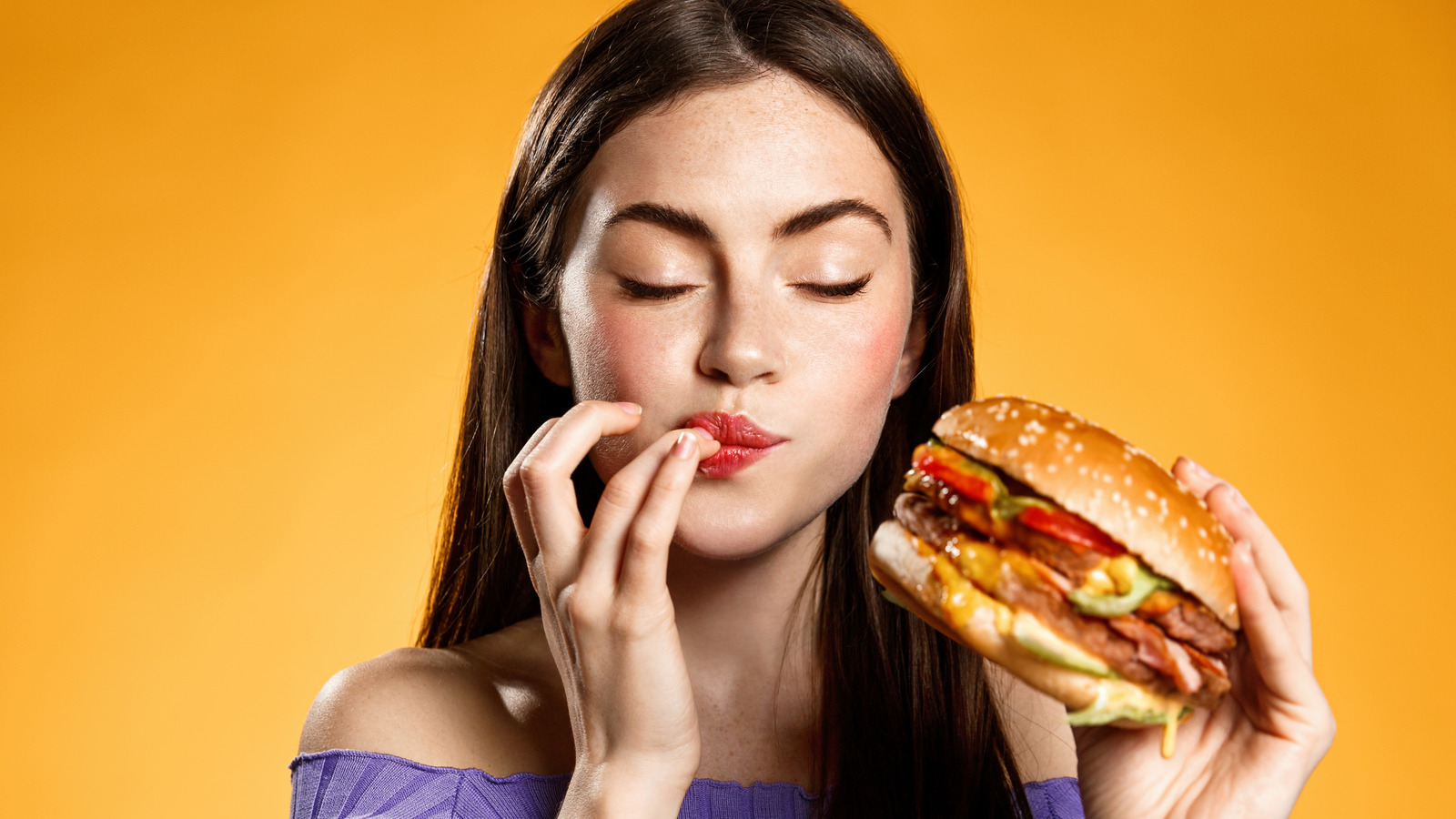 🍟 Can We Guess Your Age by Your Taste in Fast Food? Quiz Woman,Eating,Cheeseburger,With,Satisfaction.,Girl,Enjoys,Tasty,Hamburger,Takeaway,