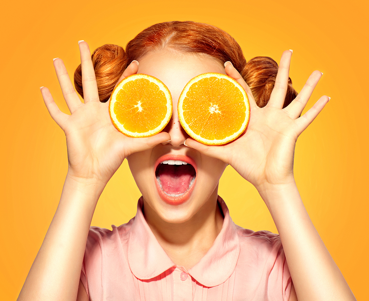 Orange Trivia Quiz Beauty Model Girl takes Juicy Oranges. Beautiful Joyful teen gir