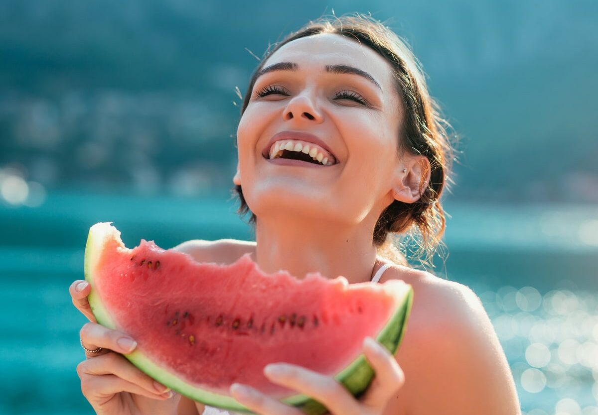 Beach Vacation Trivia Quiz Woman eating watermelon