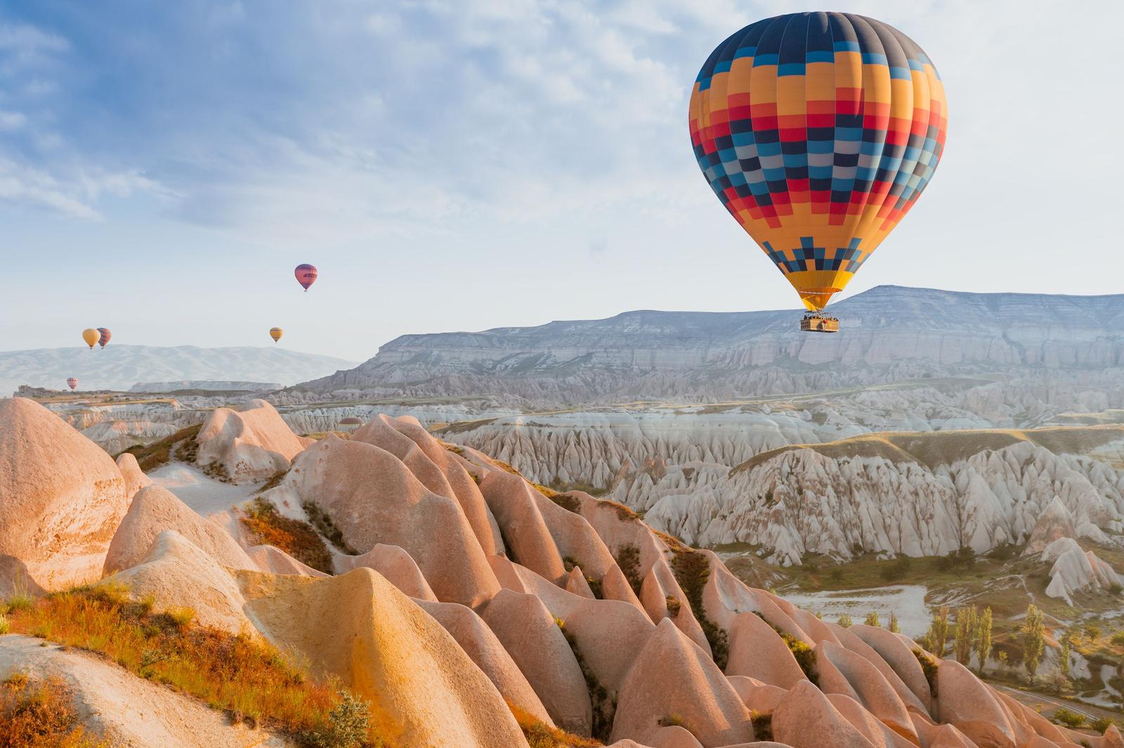 Hot air balloons over fairy chimneys, Cappadocia, Turkey