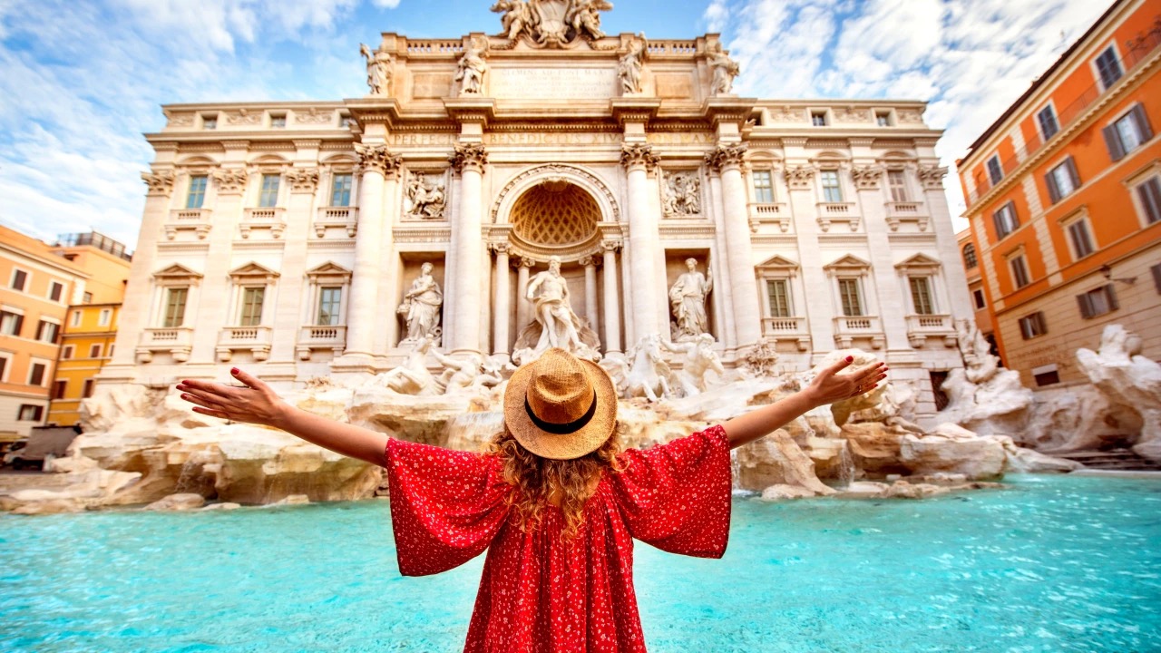 Tourist traveler at Trevi Fountain, Rome, Italy