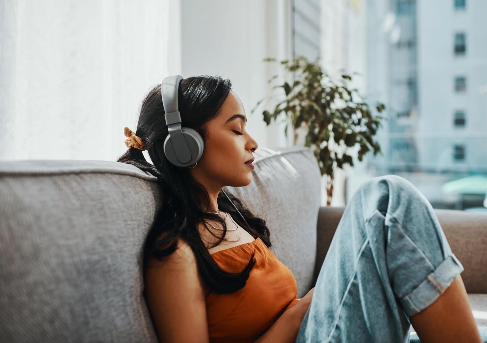 Percy Jackson Godly Parent Quiz Woman listening to music in headphones relaxation