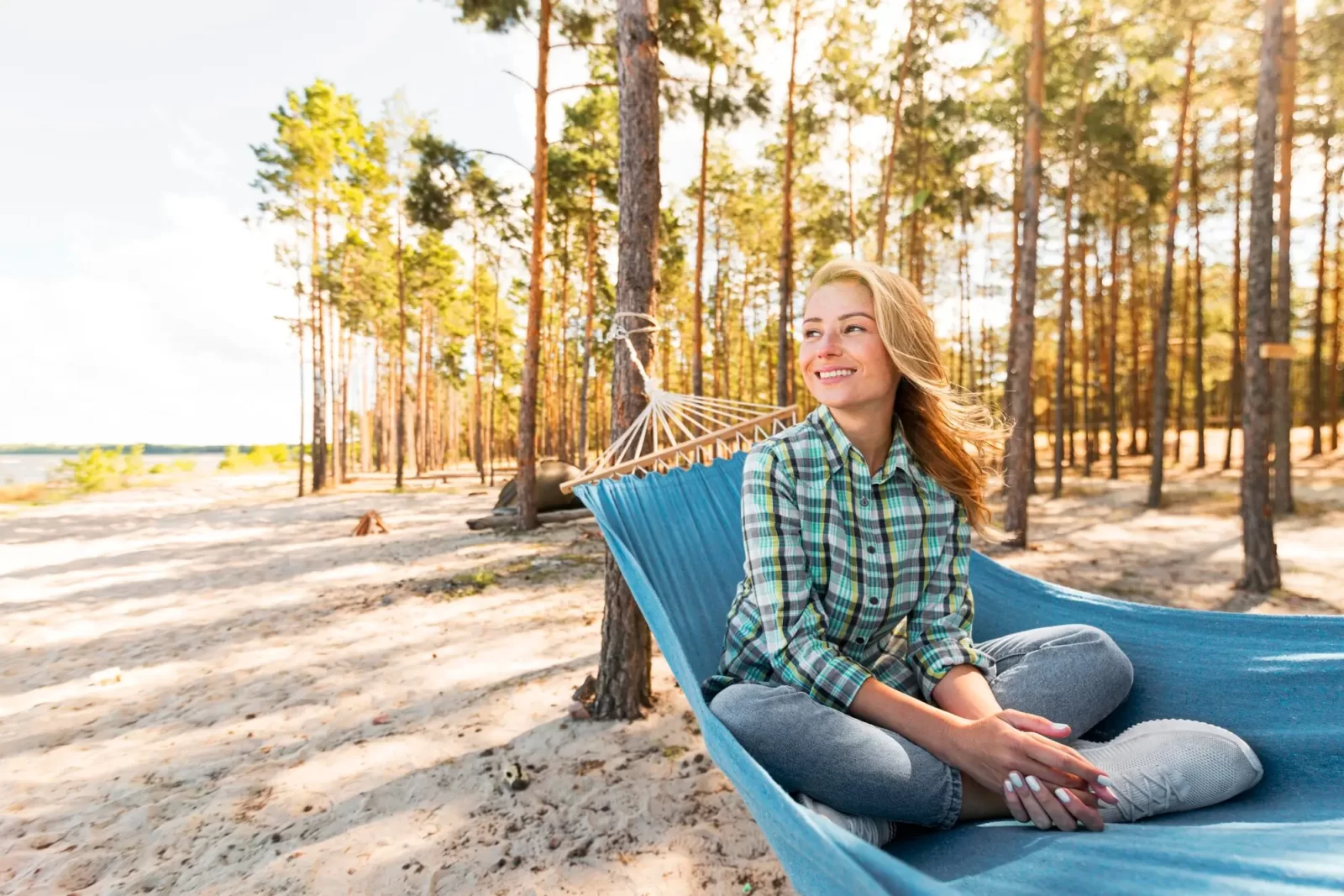 Woman relaxing weekend hammock beach