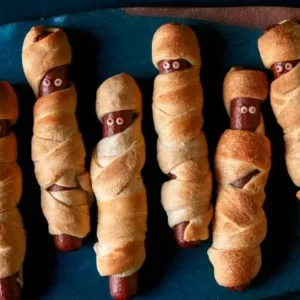 Eat Halloween Snacks To Reveal Your Horror Movie Fate Quiz Sausage mummies