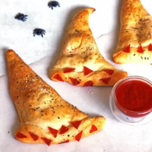 Eat Halloween Snacks To Reveal Your Horror Movie Fate Quiz Witch hat calzones