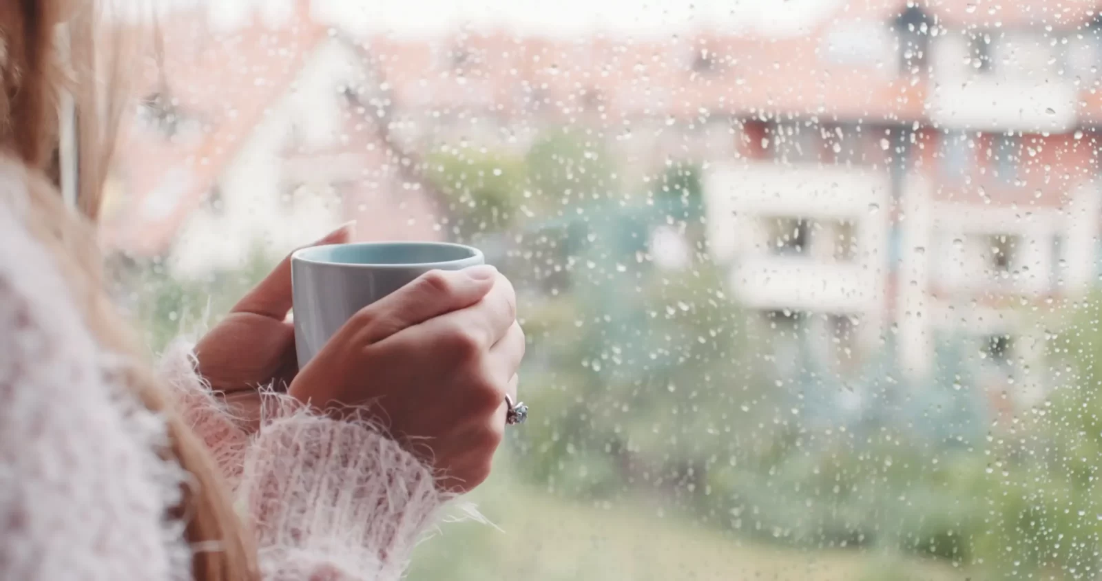 Cozy Fall Day Quiz Holding cup on a cozy rainy day