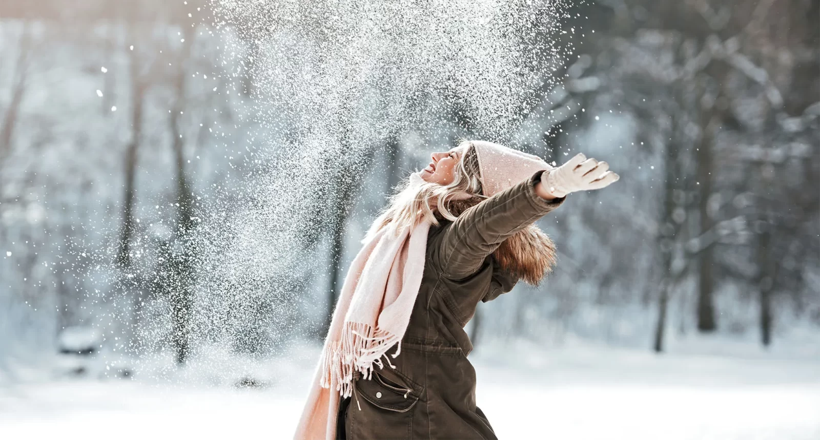 Which Winter Legend Are You? Quiz Happy woman in winter snow