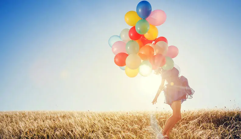 Spontaneous optimistic freedom positive girl colorful balloons